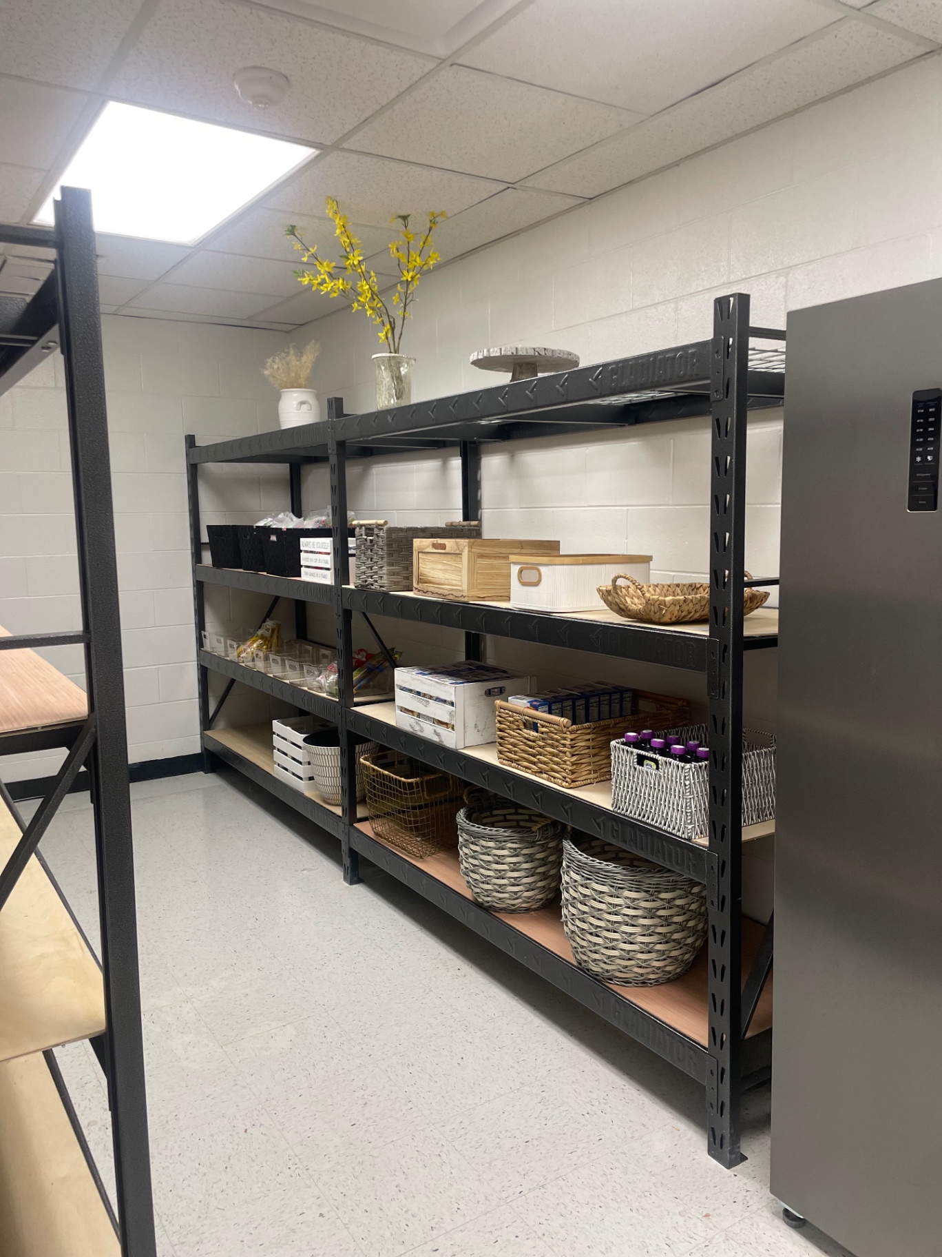 Thoughtfully organized pantry shelves with woven baskets and fresh supplies